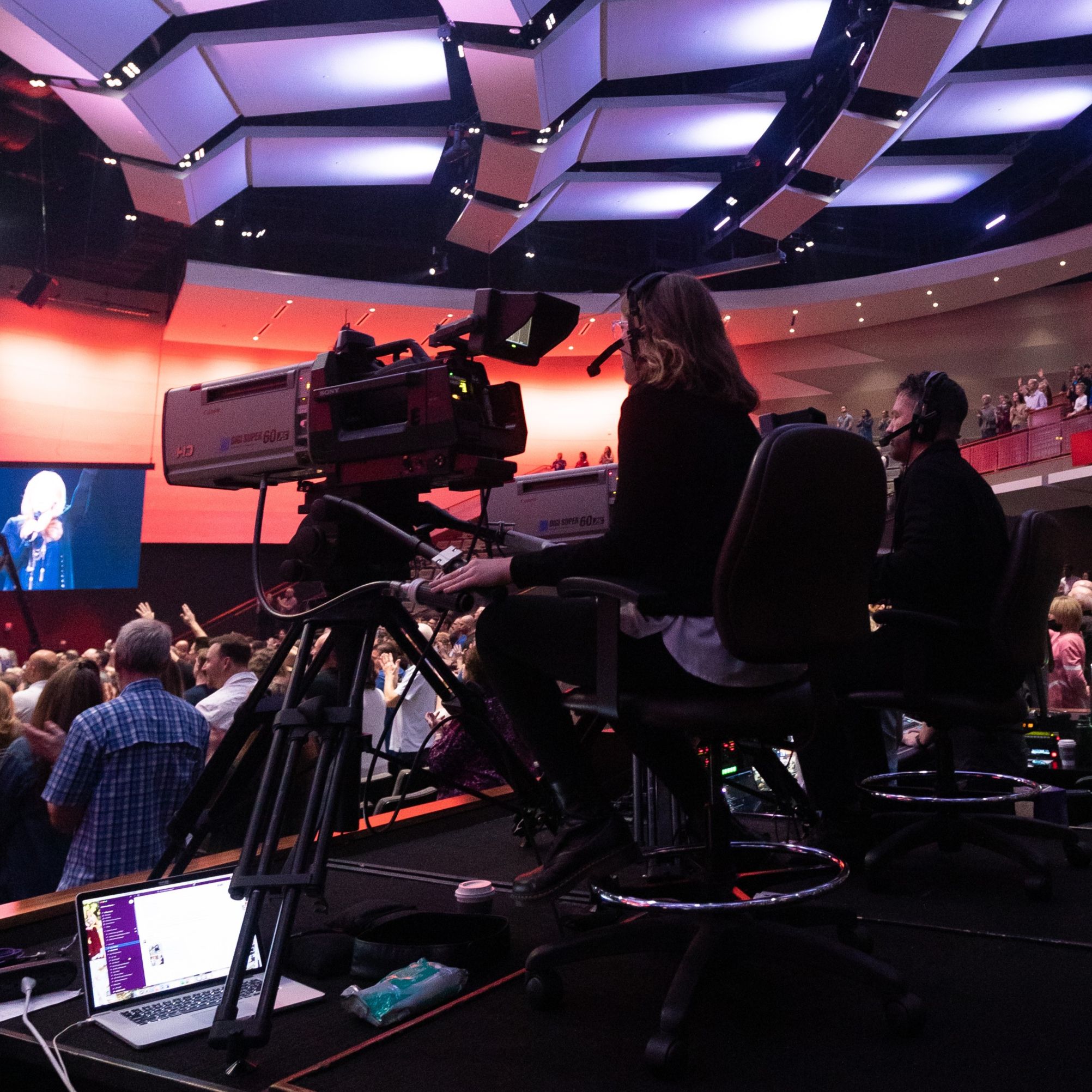 Woman on taking video on large camera